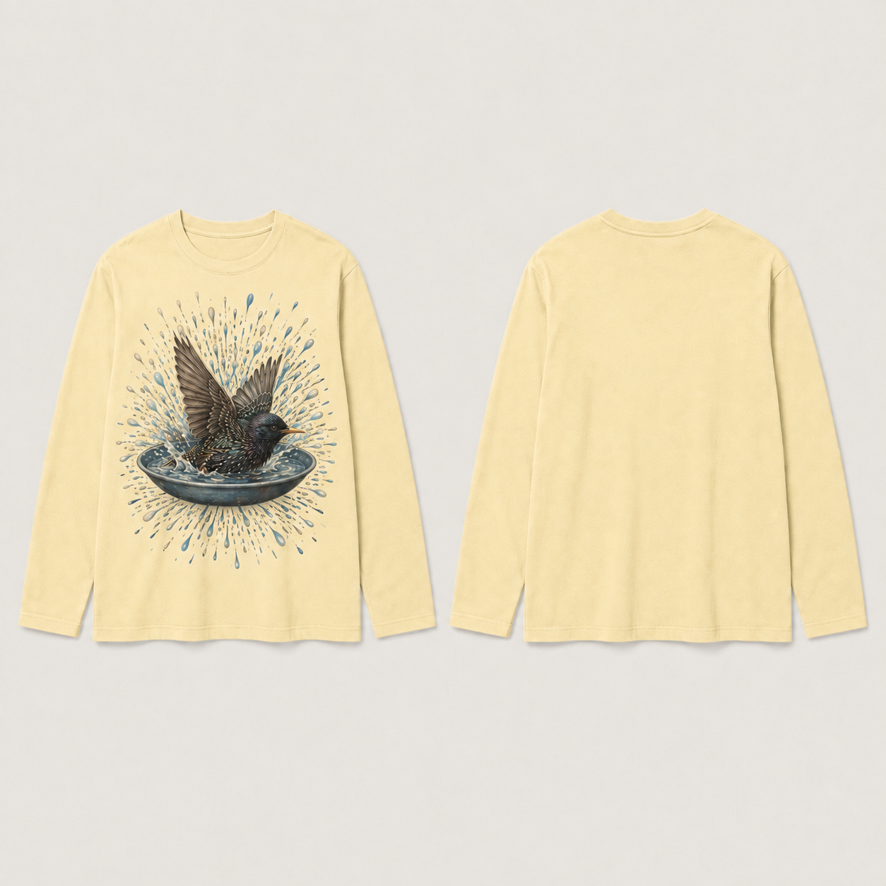 The same starling-and-water long-sleeve tee in pale butter, with the back and sleeves plain.