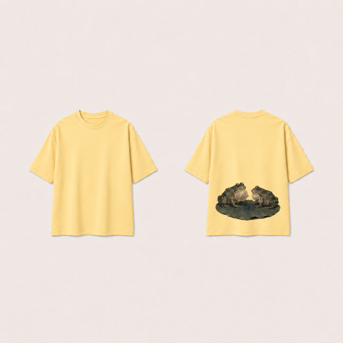 Pale Maize heavyweight tee with the same two calling frogs and leaf on the lower back; plain front.