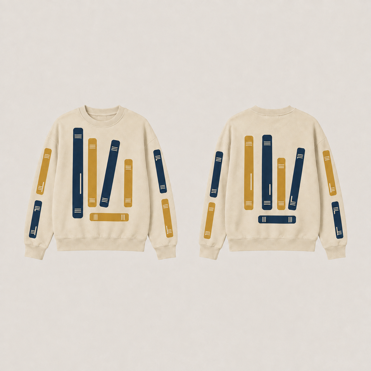 Front and back of a warm oat crewneck with the same bounded book-spine pattern in ink and ochre.