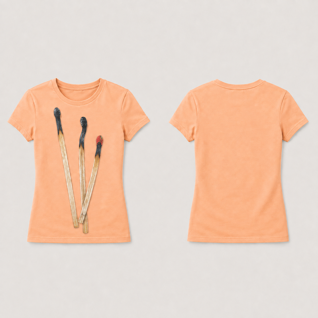Soft Apricot fitted tee shown front and back, with three used wooden matches in an unequal fan printed on the front.
