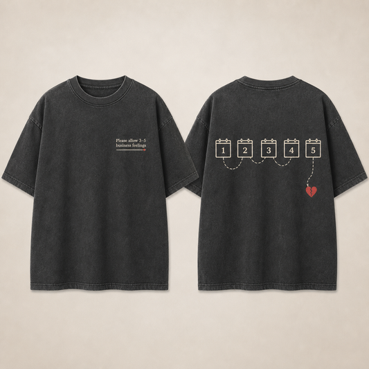 Front and back of a washed-charcoal oversized tee with a small business feelings tracking notice and a parcel route ending at a heart.