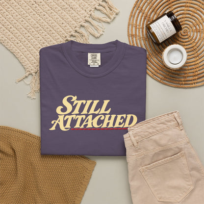 Supplier-generated Still Attached Tee mockup 4: Wine Comfort Colors 1717 with the current front and back artwork placement.