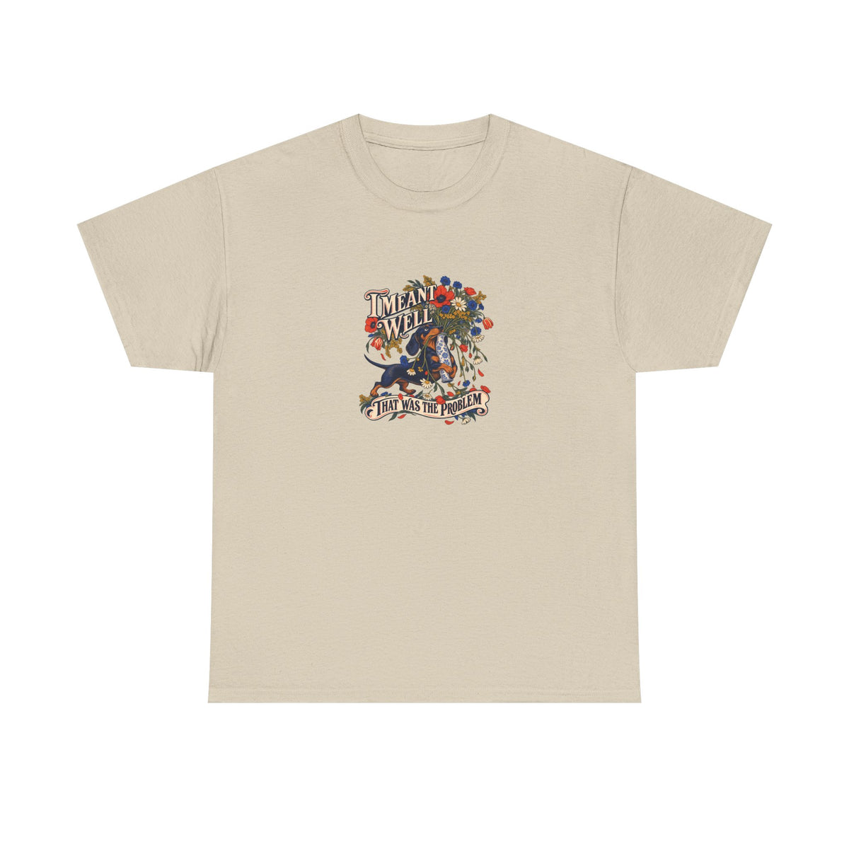 Sand Meant Well Tee, front view with dachshund holding an oversized bouquet and “I MEANT WELL THAT WAS THE PROBLEM” graphic.
