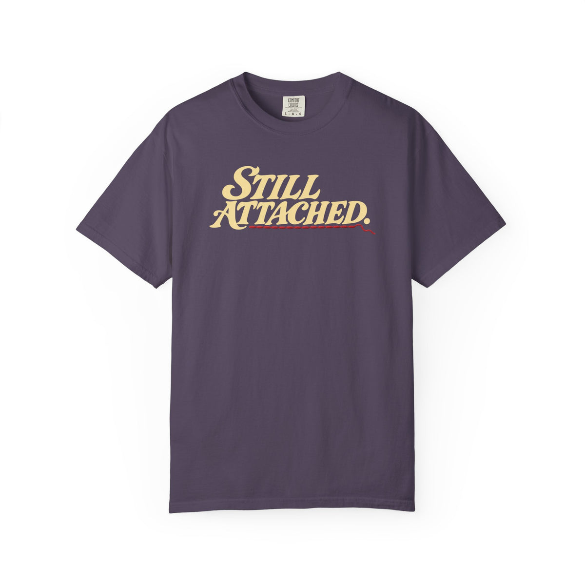 Supplier-generated Still Attached Tee mockup 1: Wine Comfort Colors 1717 with the current front and back artwork placement.