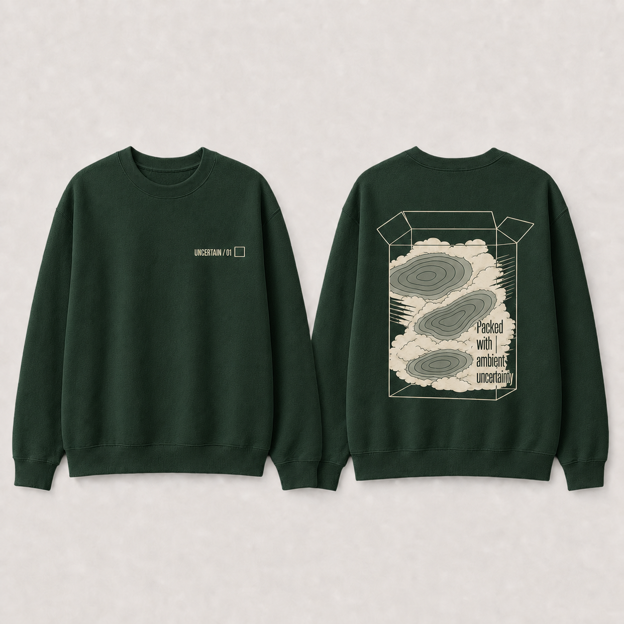 Deep-forest crewneck with packed fog and disconnected pressure cells beneath UNCERTAIN 01.