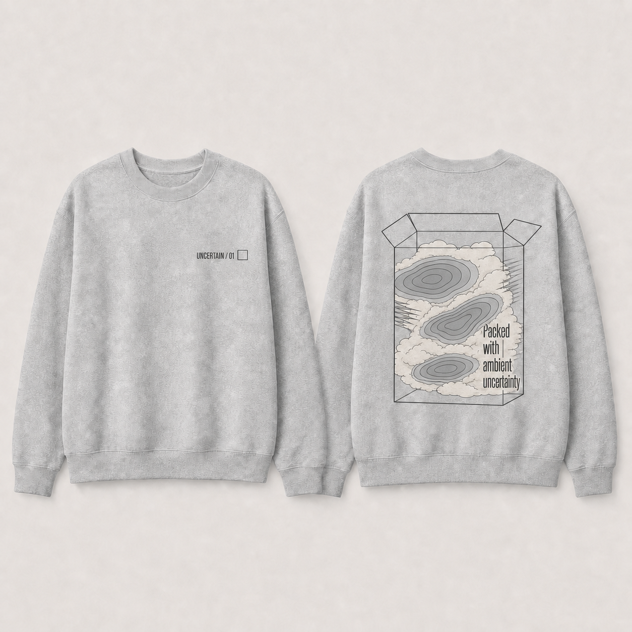 Heather-gray crewneck with packed fog and disconnected pressure cells beneath UNCERTAIN 01.