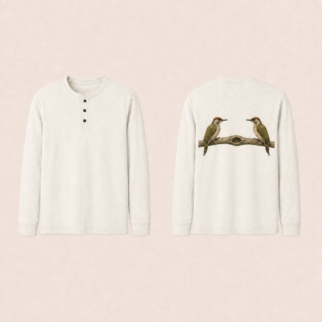 Front and back of a chalk Henley long-sleeve tee with a three-button placket; two natural woodpeckers face inward on a branch with a hollow knot on the back.