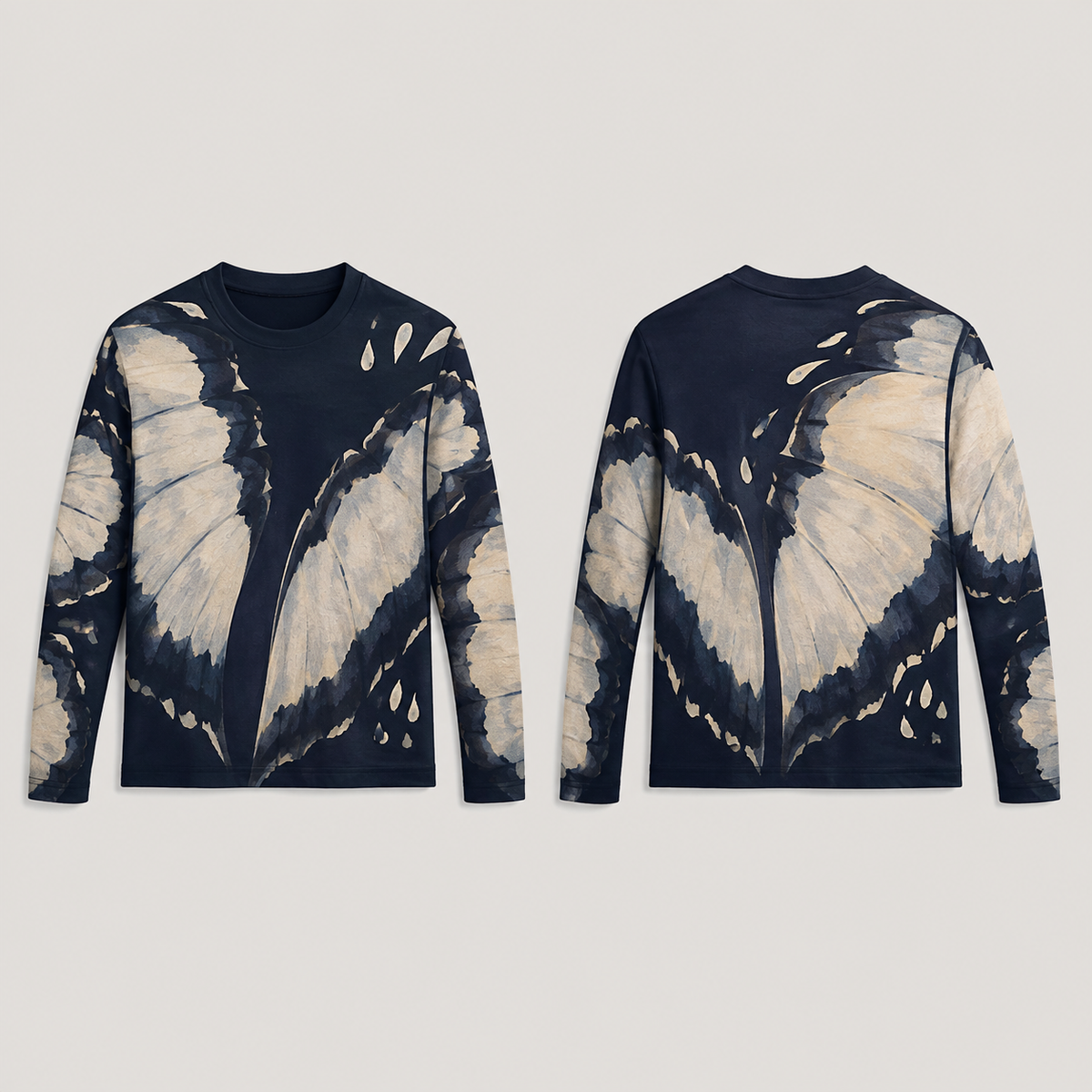 Front and back concept views of a midnight long-sleeve tee with large butter-colored scalloped wing-like fields, small teardrop spots and a dark round neckline.