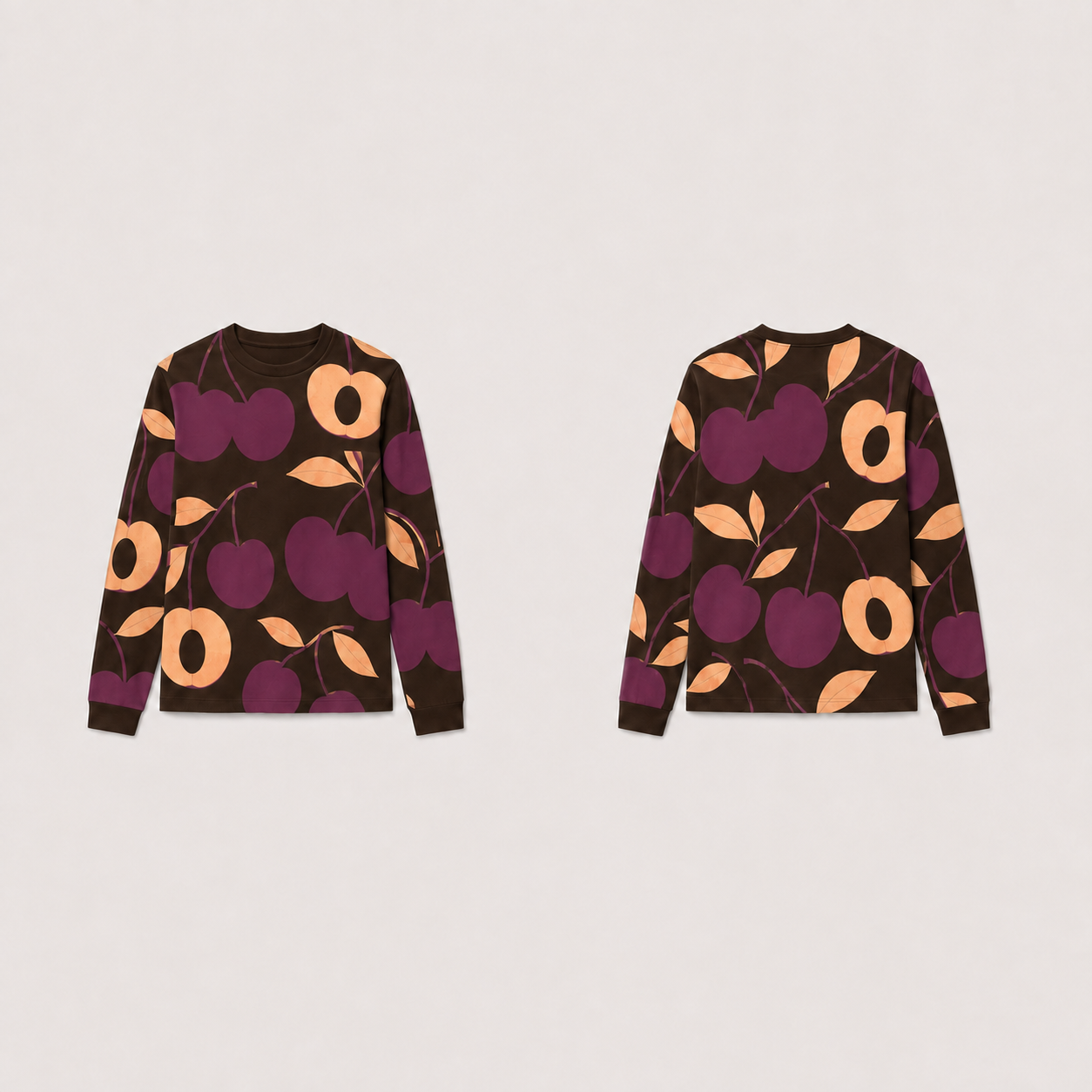 Espresso long-sleeve tee with matching plum fruitlike forms, apricot halves and leaves across front, back and sleeves.