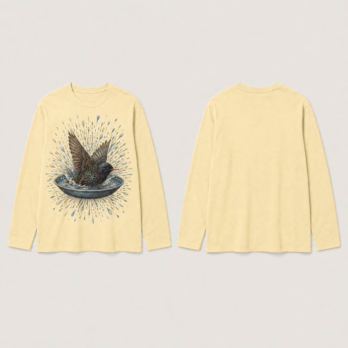 The same starling-and-water long-sleeve tee in pale butter, with the back and sleeves plain.