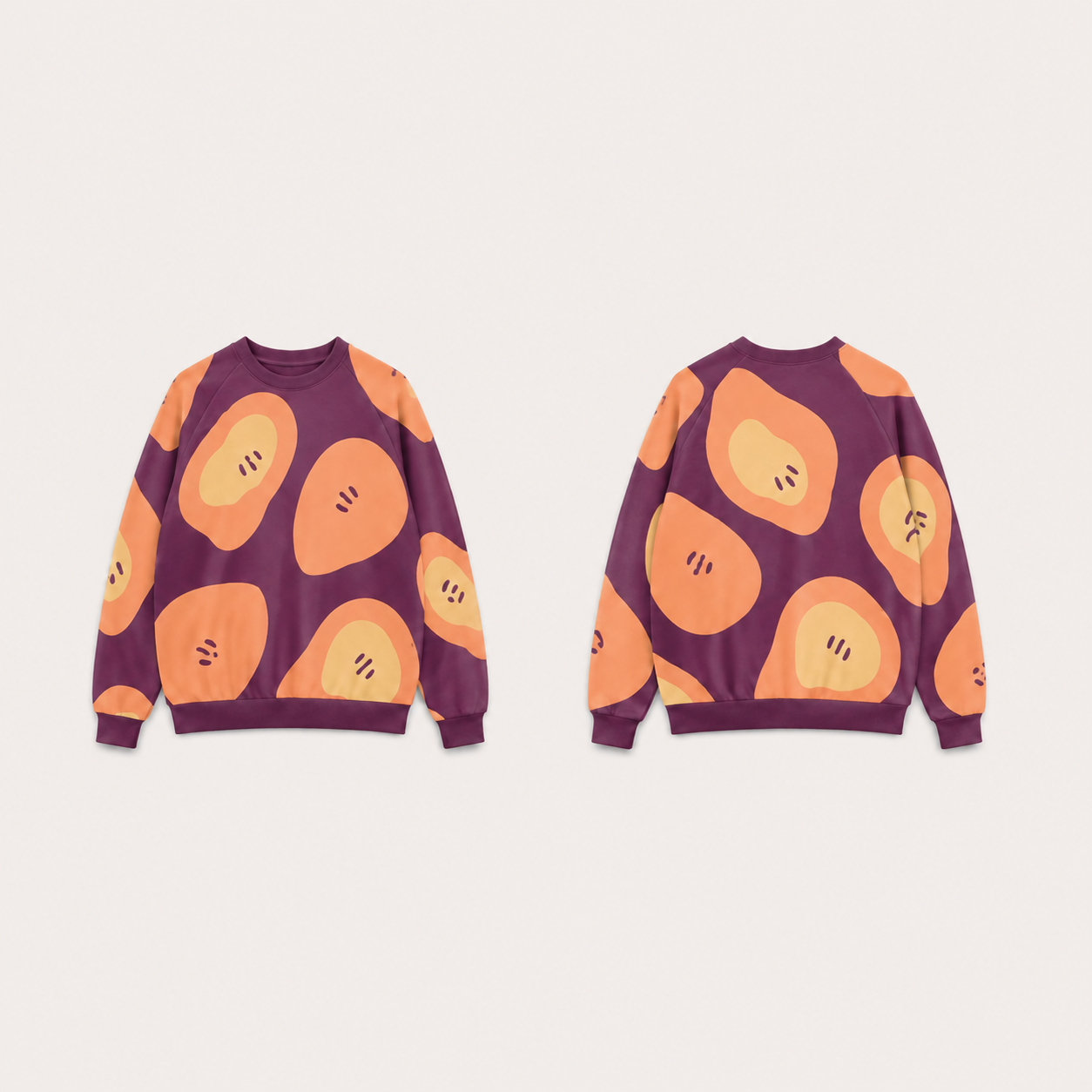 Fig raglan crewneck with oversized peach fruitlike lobes, butter inner fields and short seed marks across front, back and sleeves.
