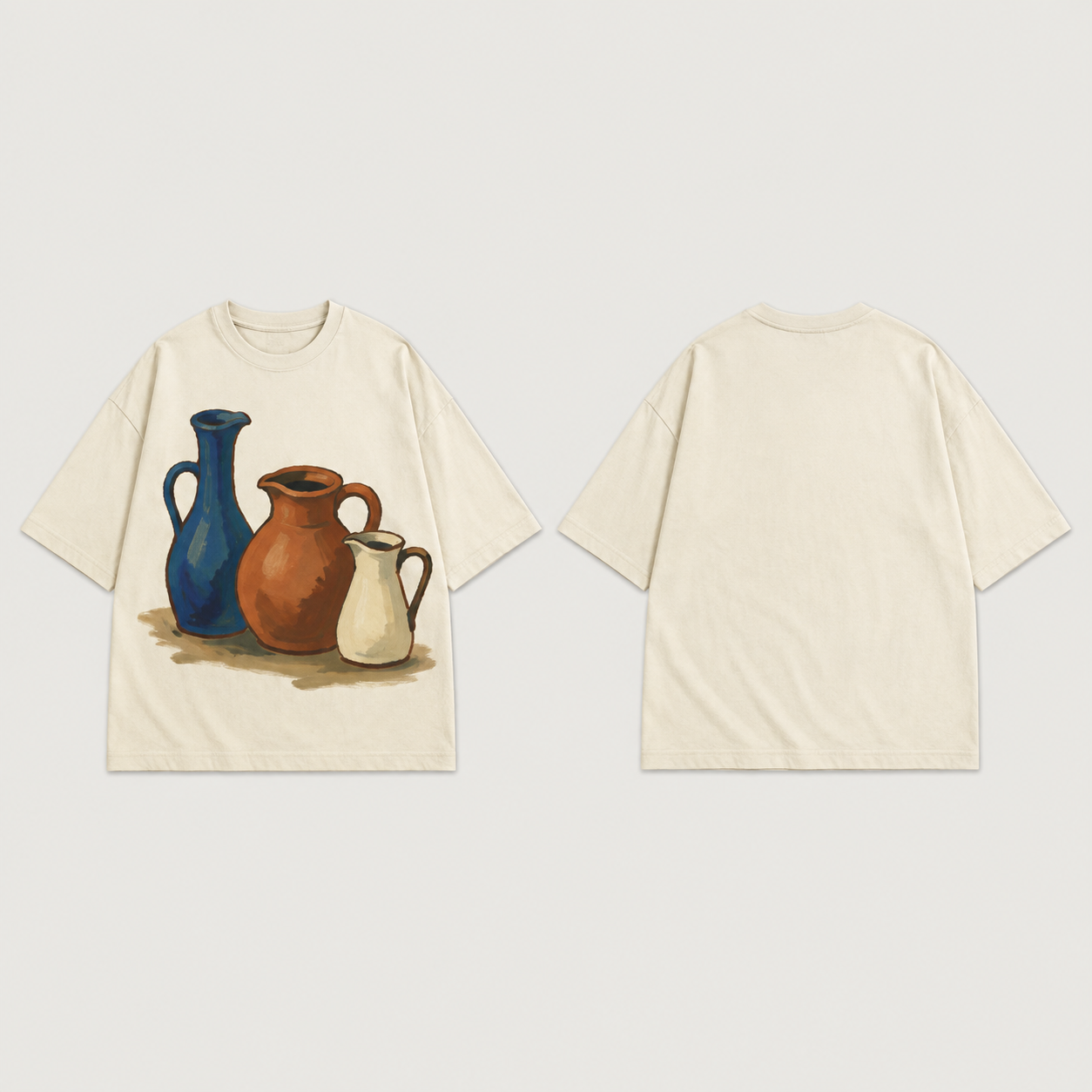 Front and back of a warm-chalk oversized tee with three painted blue, terracotta and cream ceramic pitchers on the front and a plain back.