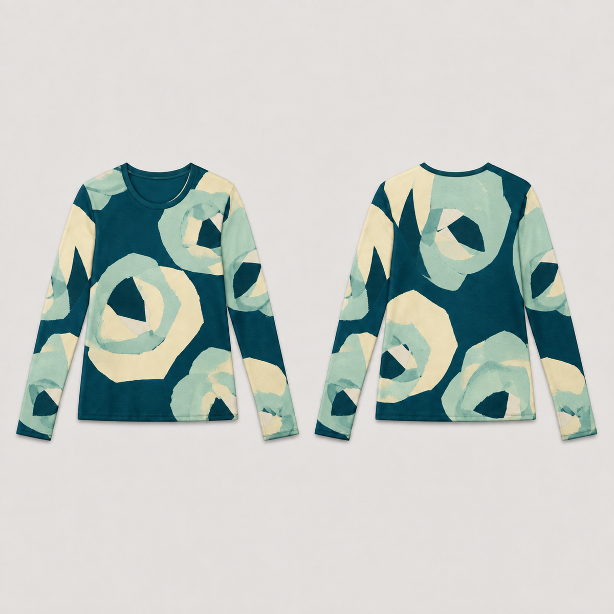 Front and back of a petrol long-sleeve tee with large layered butter-and-mint paper-rosette forms and small angular cream gaps.