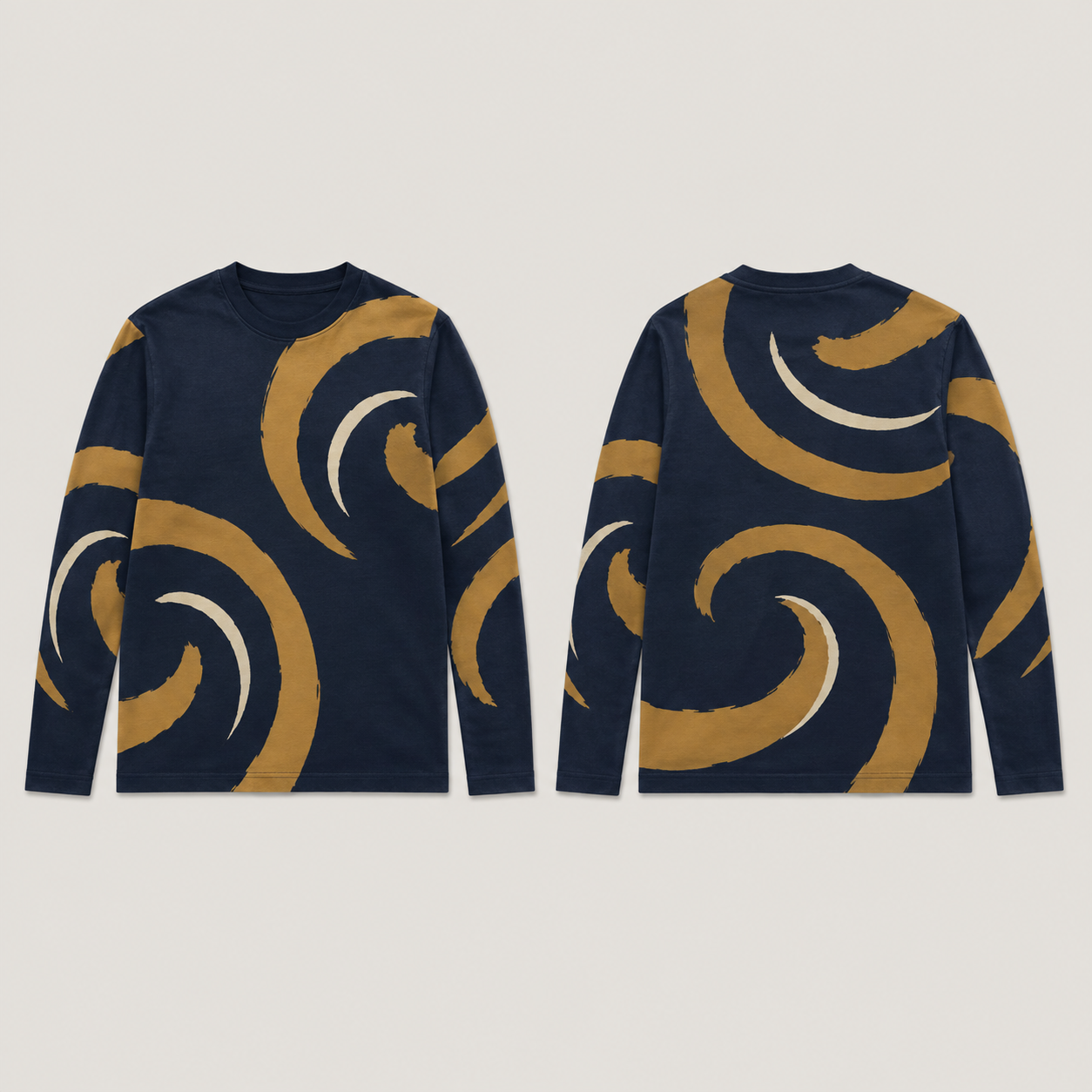 Front and back of an ink-navy long-sleeve tee with large open ochre volutes and slender cream countercurves across the body and sleeves.