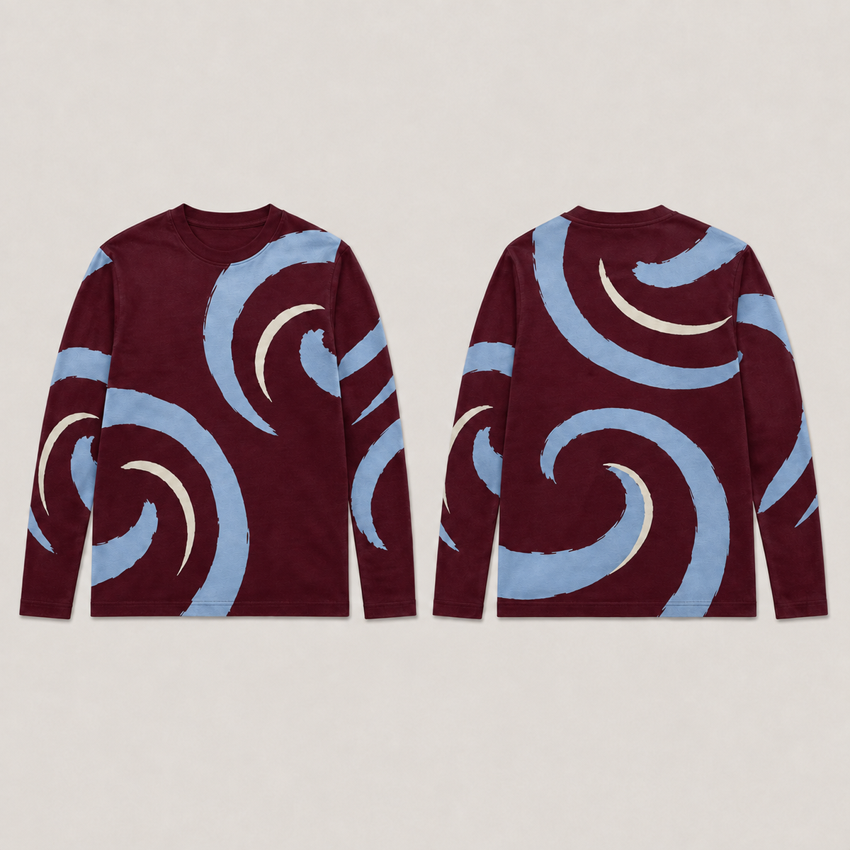 Front and back of a claret long-sleeve tee with large open pale-blue volutes and slender cream countercurves across the body and sleeves.