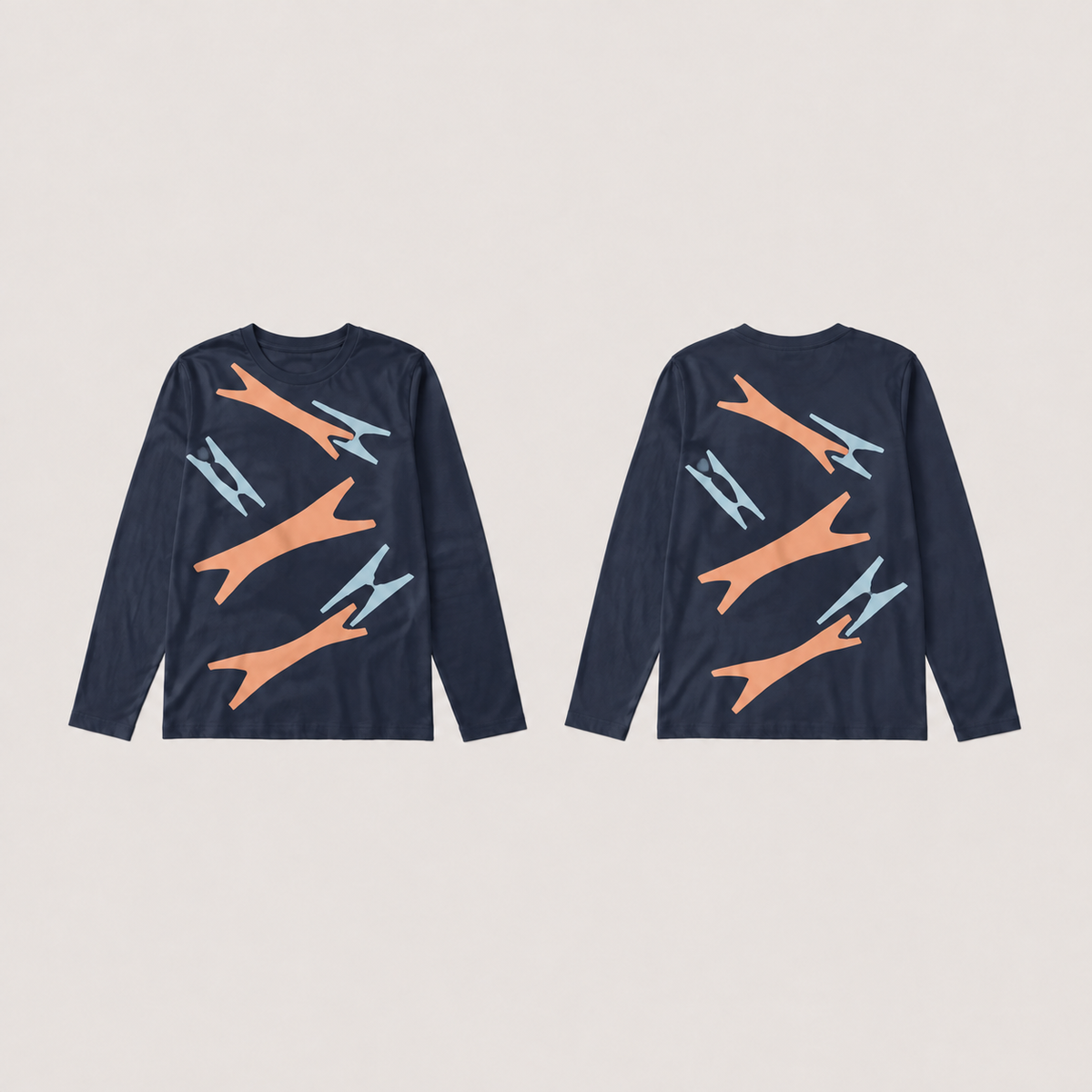 Front and back of an ink long-sleeve tee with the same open notched pattern in apricot and pale blue.