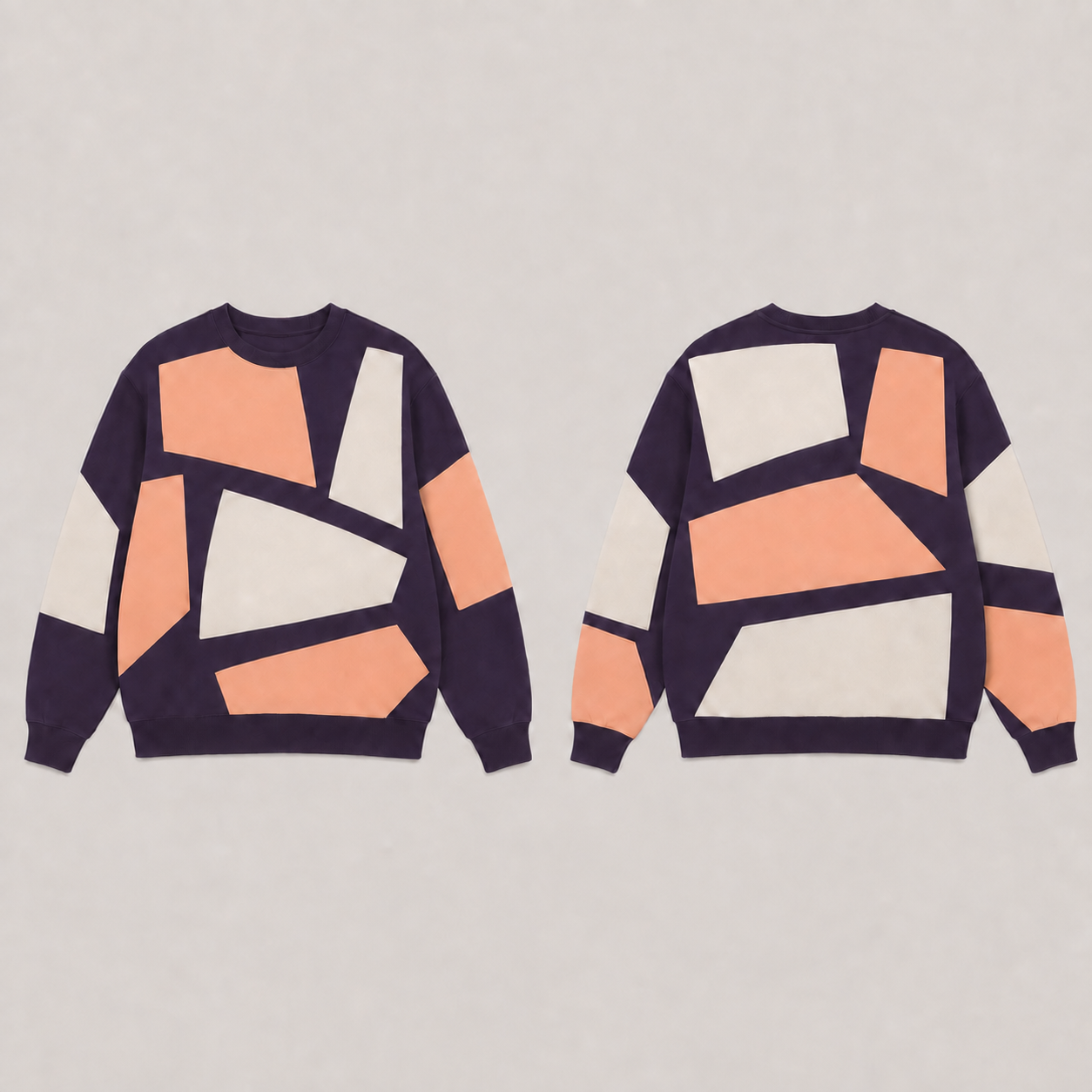 Front and back of an aubergine crewneck sweatshirt with large irregular apricot and cream shapes.