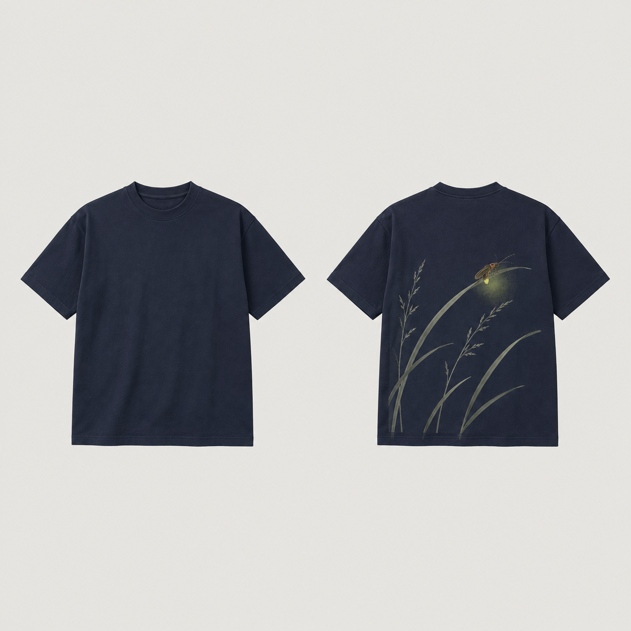 Front and back of a night-navy tee; pale arching grasses and a small firefly with a painted yellow-green glow appear on the back, with a plain front.
