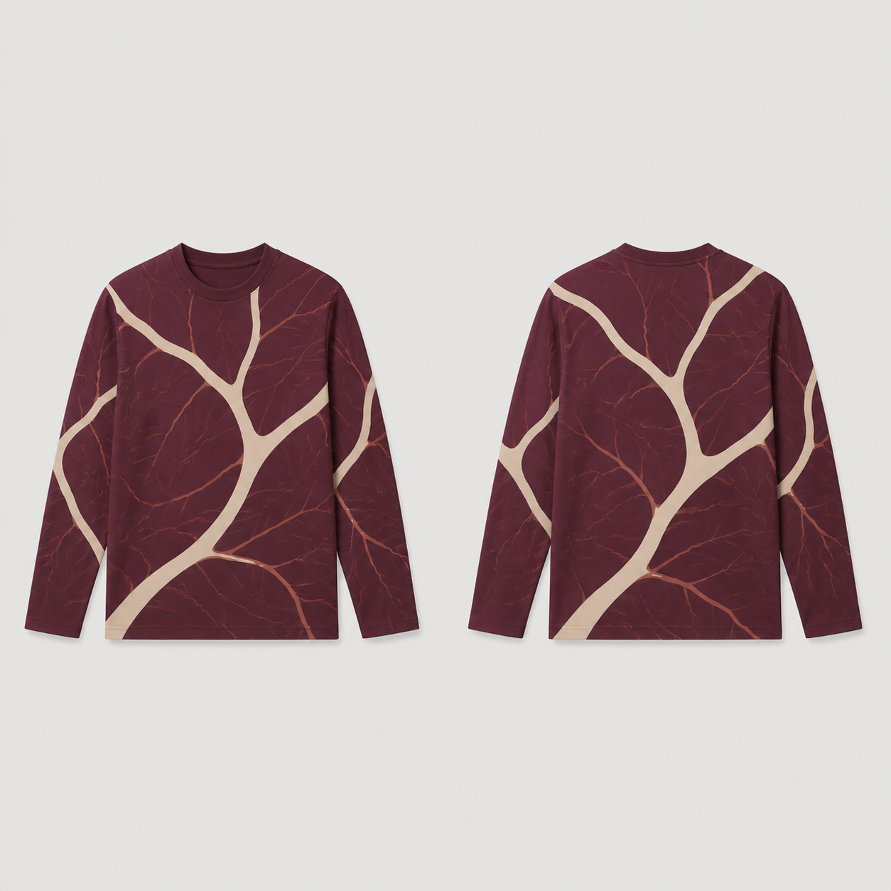 Front and back of a wine long-sleeve tee with curving cream branches and finer rose veins.