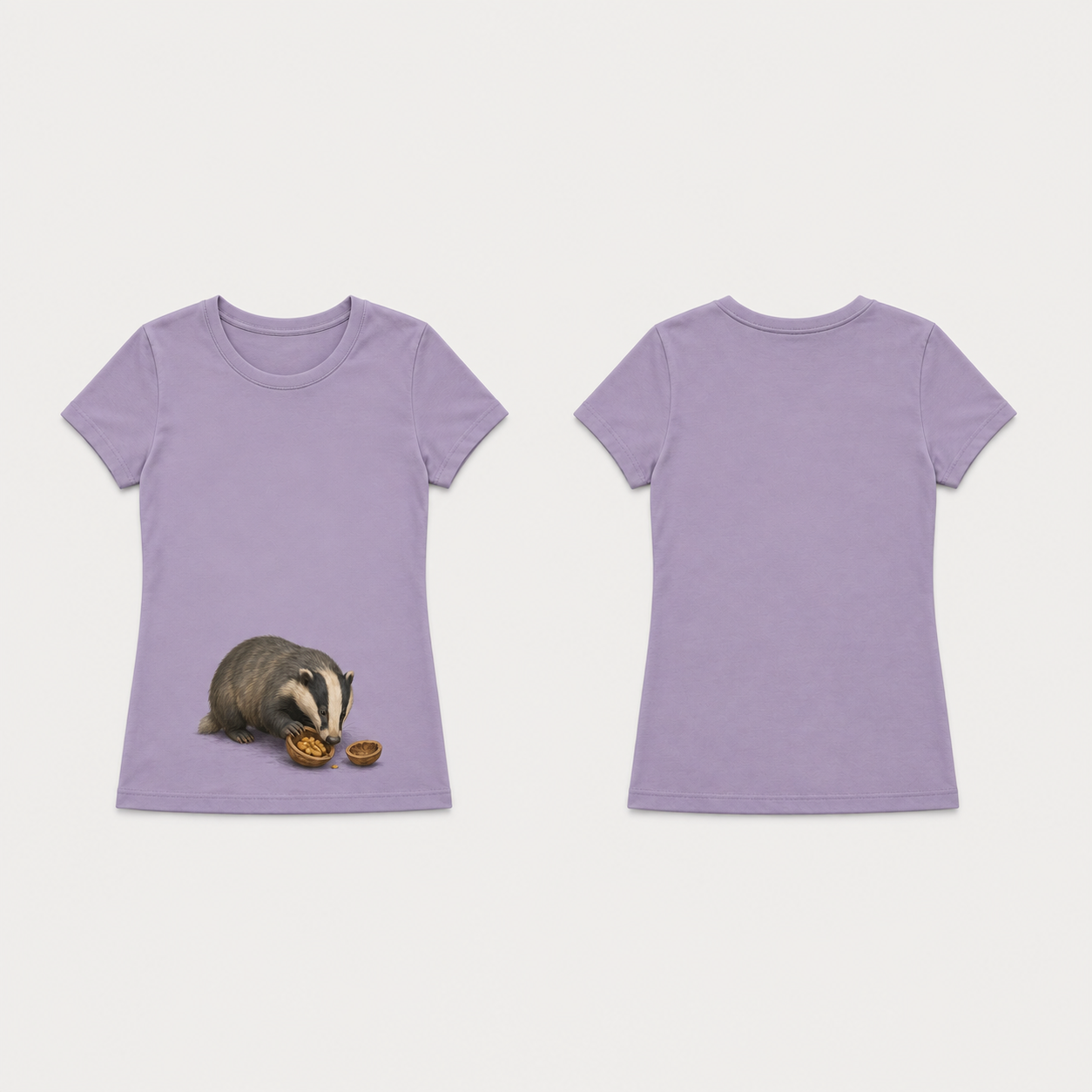Dusty lavender fitted tee with a badger investigating a walnut half low on the front, beside a separate empty shell; plain back.