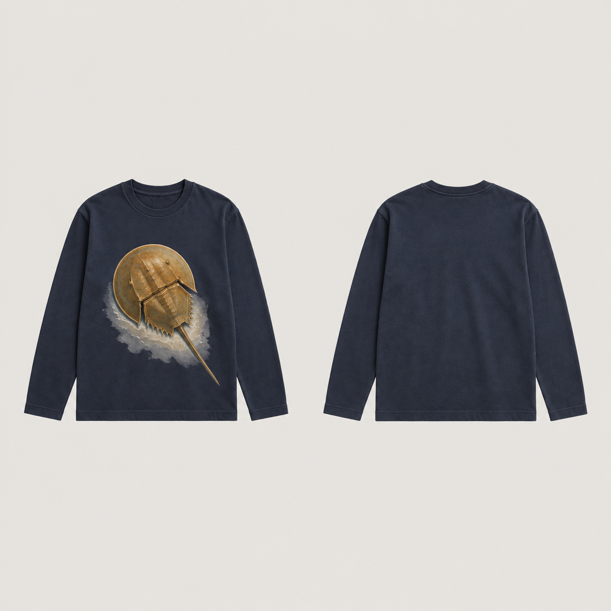 Front and back of a washed-ink long-sleeve tee; an overhead ochre horseshoe crab and pale water wash occupy the front, with a plain back.