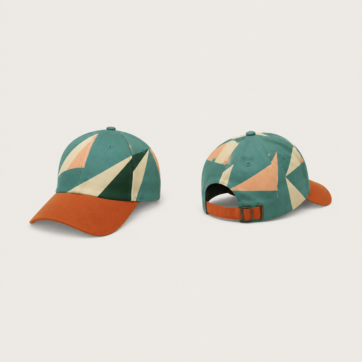 Front and rear views of a sea-green cap with large cream, peach and dark-green sail-like shapes across the crown, a burnt-orange peak and matching adjustable strap.
