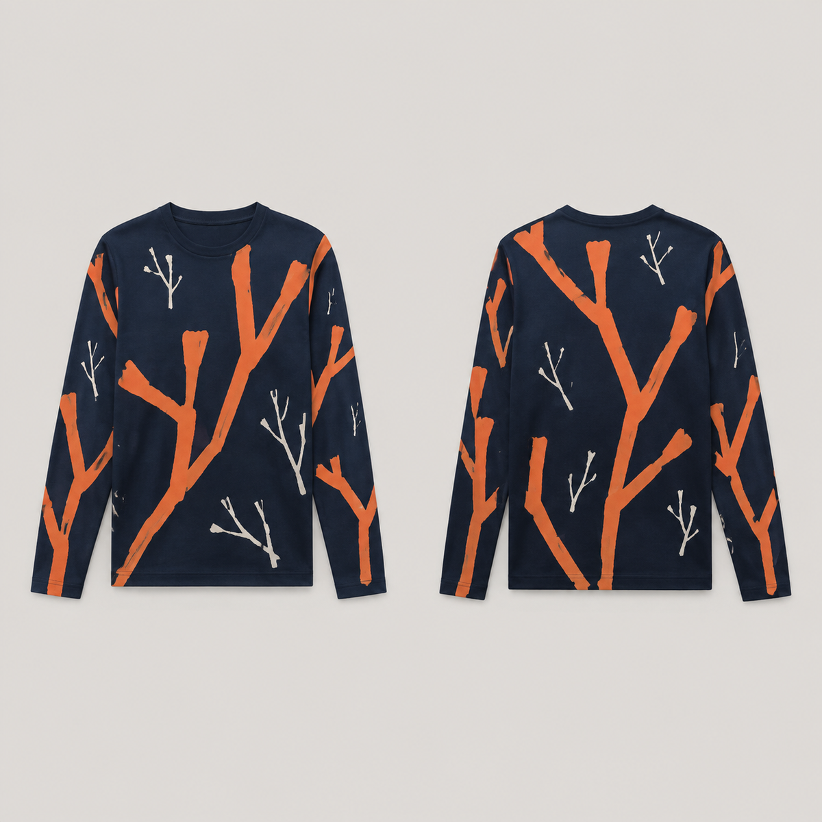 Front and back of an ink-navy long-sleeve tee with large blunt papaya branches and smaller chalk branching strokes across body and sleeves.