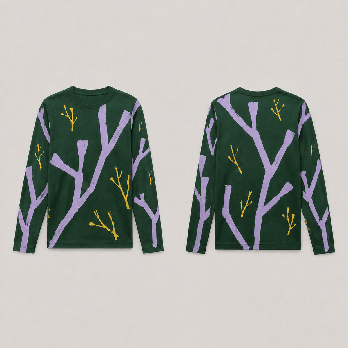 Front and back of a forest-green long-sleeve tee with large blunt lilac branches and smaller ochre branching strokes across body and sleeves.