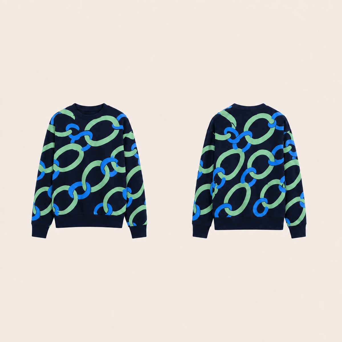 Midnight crewneck with matching large celadon and cobalt linked-ring ornament across front, back and sleeves.