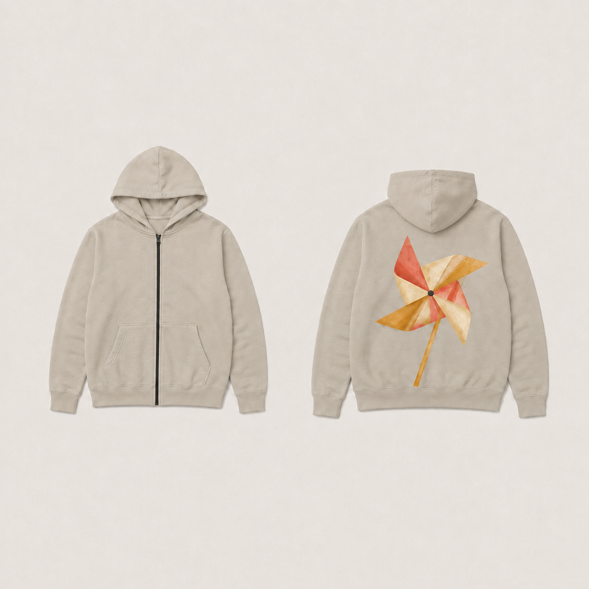 Front and back of a warm-silt zip hoodie with a coral, cream and ochre pinwheel on the back, dark zipper and plain front pockets.