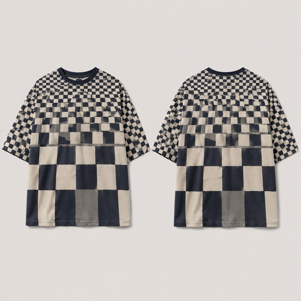 Front and back of an oversized chalk, ink-navy and gray tee with checks increasing in size from shoulder to hem.