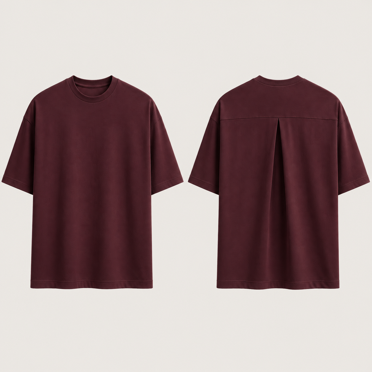 Front and back of the same oversized tee in deep oxblood, preserving its plain front and single high-back inverted box pleat.