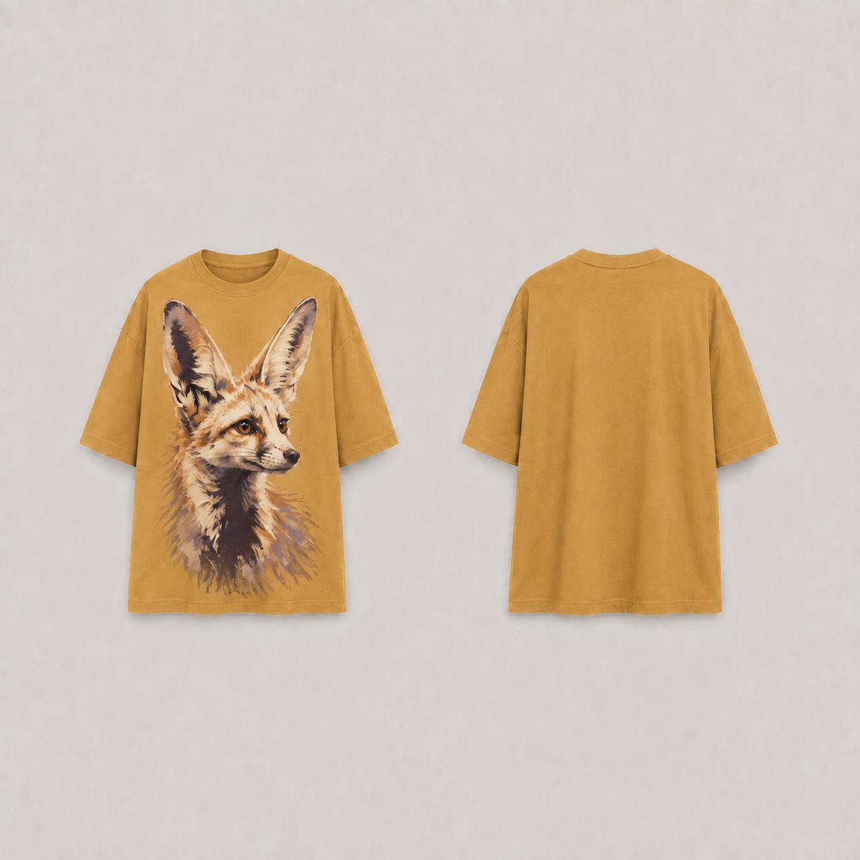 Front and back of the same fox-portrait oversized tee in faded ochre.