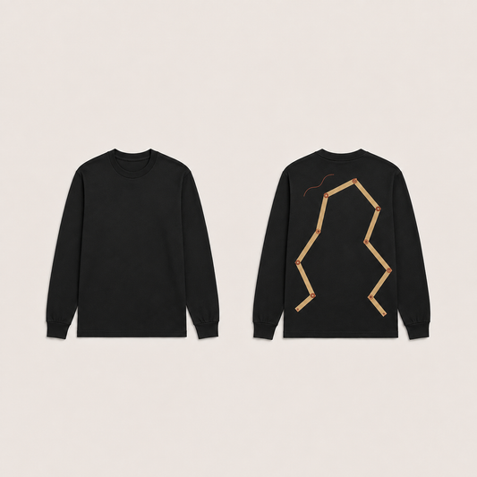 Front and back of an Ink Black long-sleeve tee, with an open articulated pale wooden-rule drawing and a separate rust-red curve on the back.