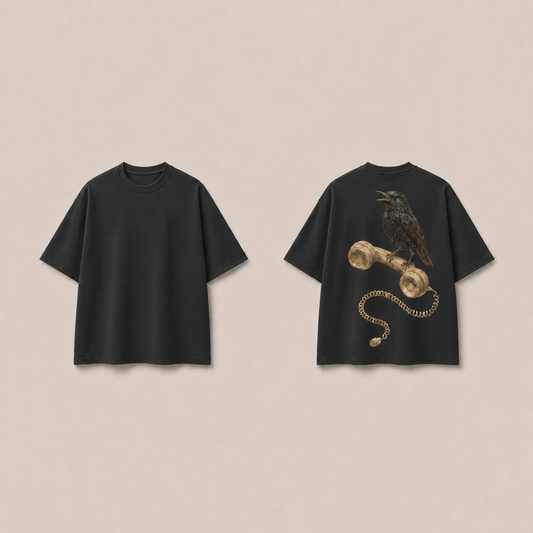 Front and back of a Washed Black oversized tee, with a natural speckled bird perched on a cream telephone receiver and a loose coiled cord ending below it on the back.
