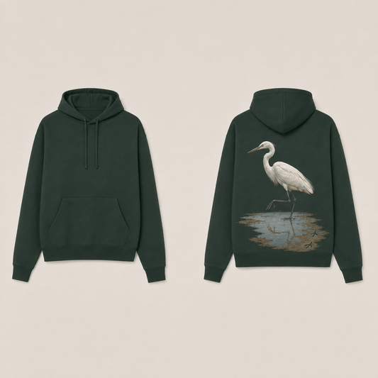 Front and back views of a forest-green pullover hoodie with a white egret lifting one foot from a shallow muddy puddle on the back.