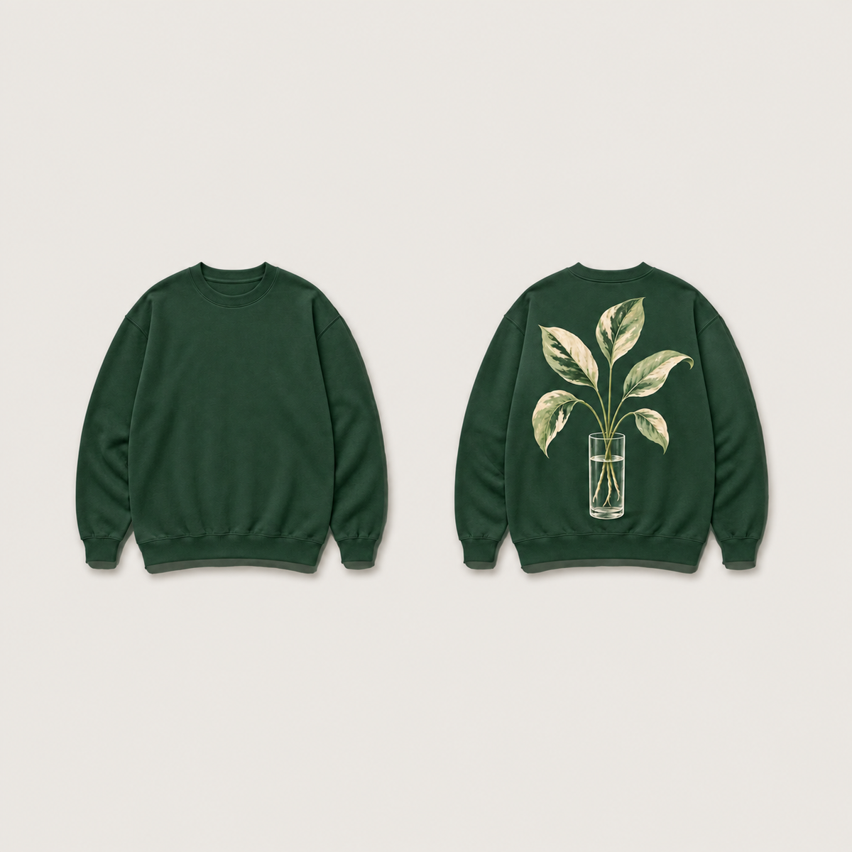 Front and back of a bottle-green crewneck, with a five-leaf plant cutting and its roots in a clear tumbler drawn on the back.